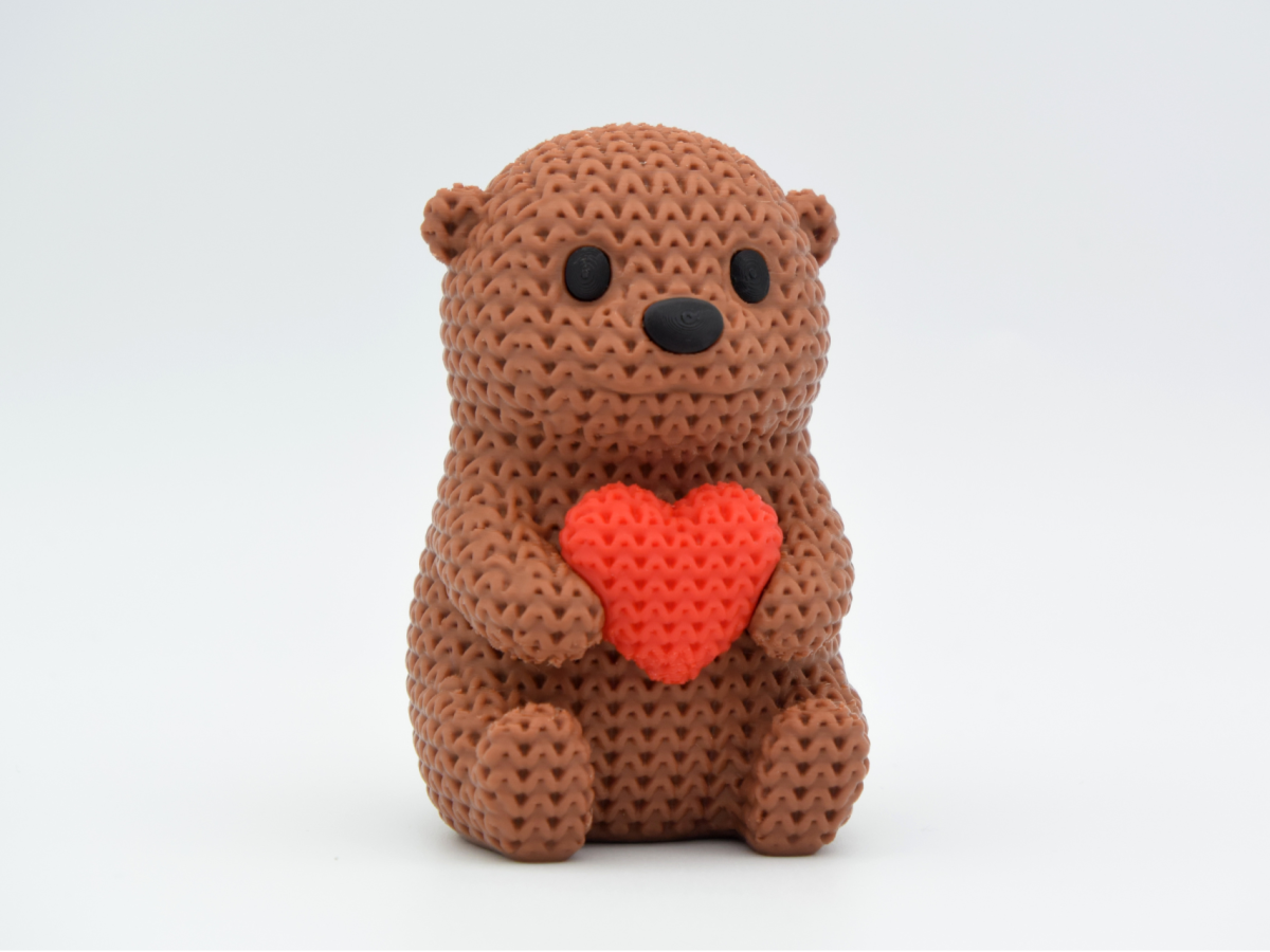 Knitted Otter With Heart — видра із сердечком